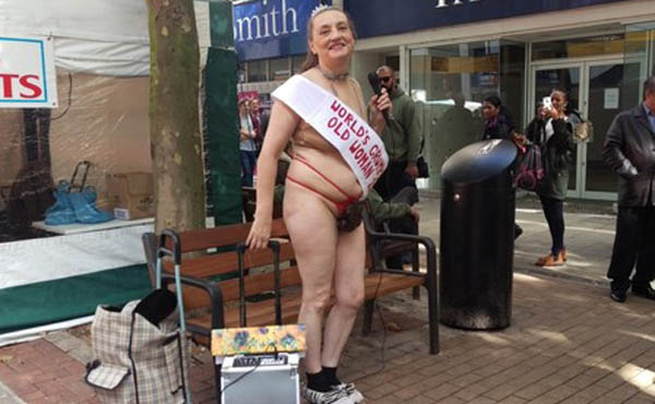 Nearly naked grumpy old woman glues bum to Croydon department store in protest photo